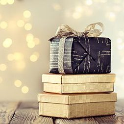 Composed stack of wrapped and decorated boxes with Christmas pre