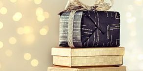 Composed stack of wrapped and decorated boxes with Christmas pre