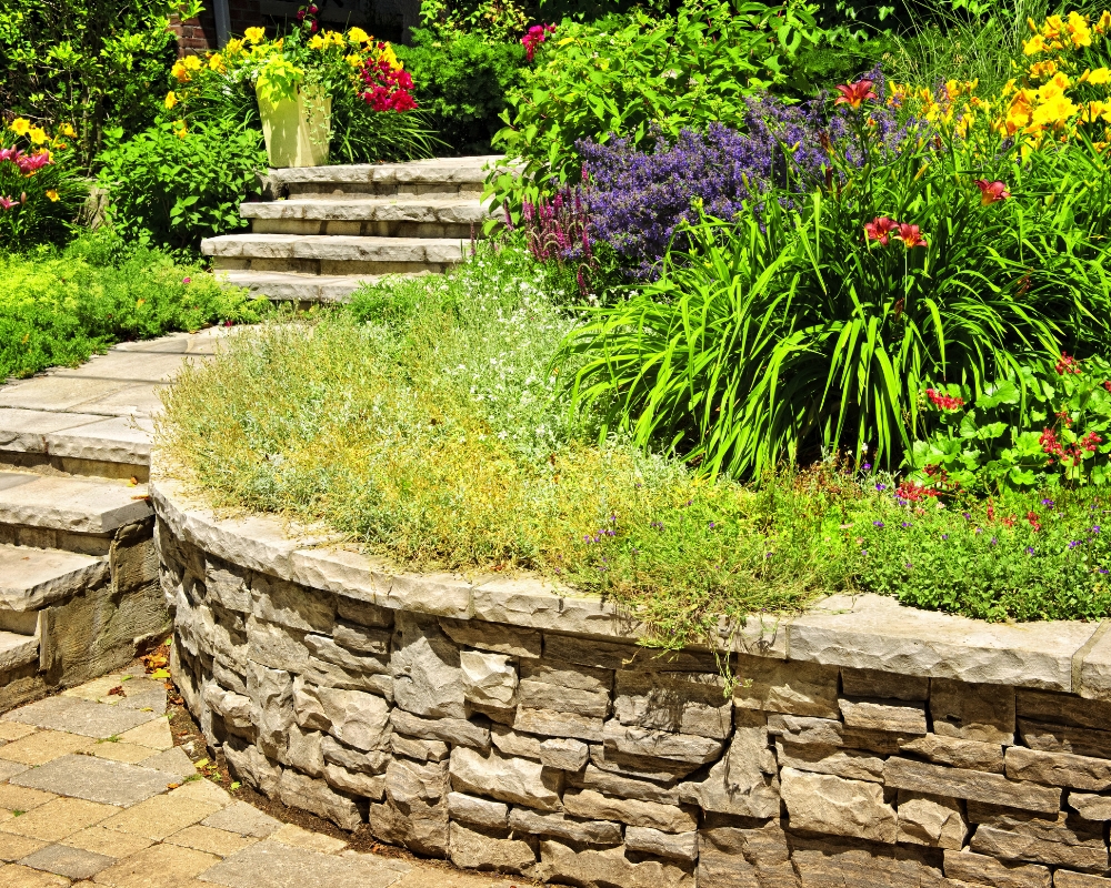 Stone wall and steps leading up garden
