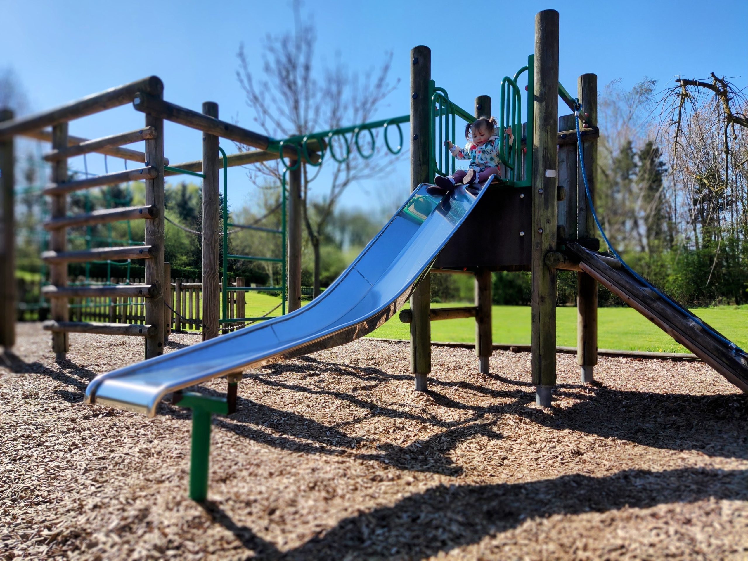 Child playing on the play area slide at Gordale Garden Centre